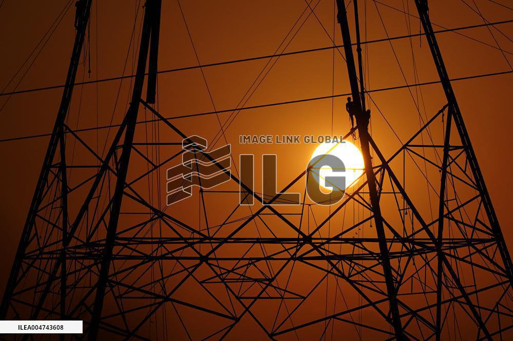 Workers Are Installing a High-Voltage Electricity Pylon - India