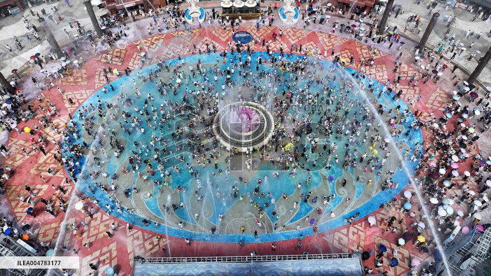 Tourists Attend Water-Splashing Event - Jinghong