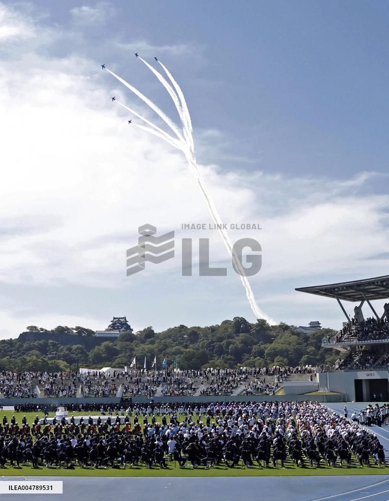 Blue Impulse aerobatic team flies over sports festival venue