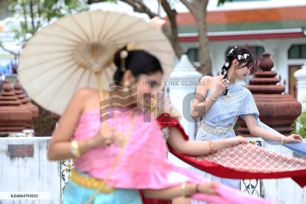 Tourists in Thai Traditional Costumes - Bangkok