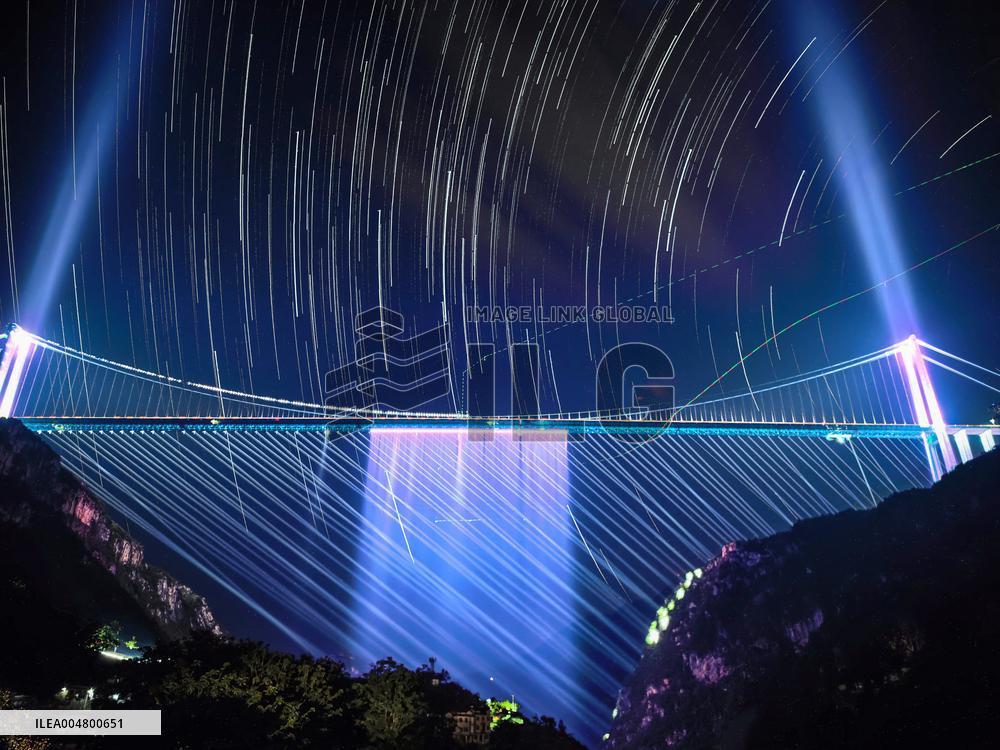 Huajiang Grand Canyon Bridge At Night - China