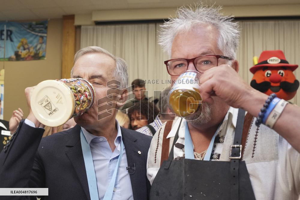 Prime Minister Taps Keg At Oktoberfest - Canada