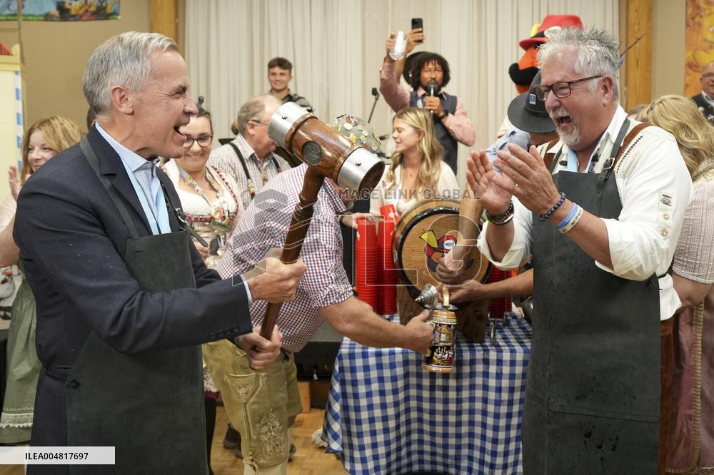 Prime Minister Taps Keg At Oktoberfest - Canada