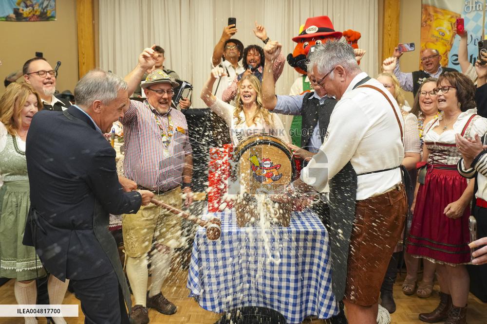 Prime Minister Taps Keg At Oktoberfest - Canada