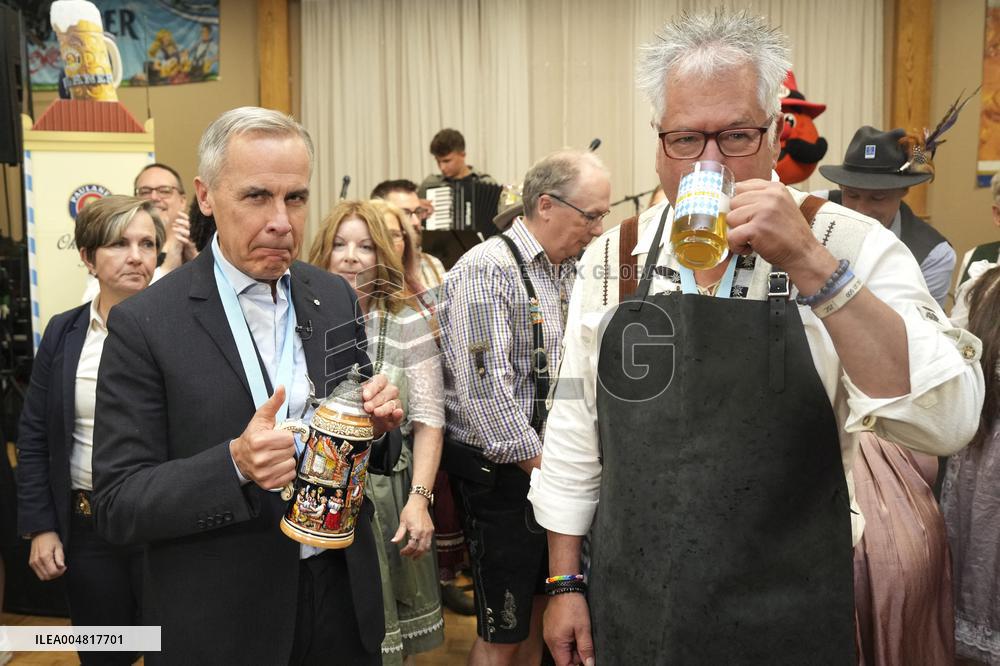 Prime Minister Taps Keg At Oktoberfest - Canada
