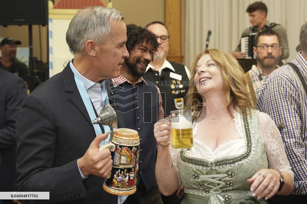 Prime Minister Taps Keg At Oktoberfest - Canada