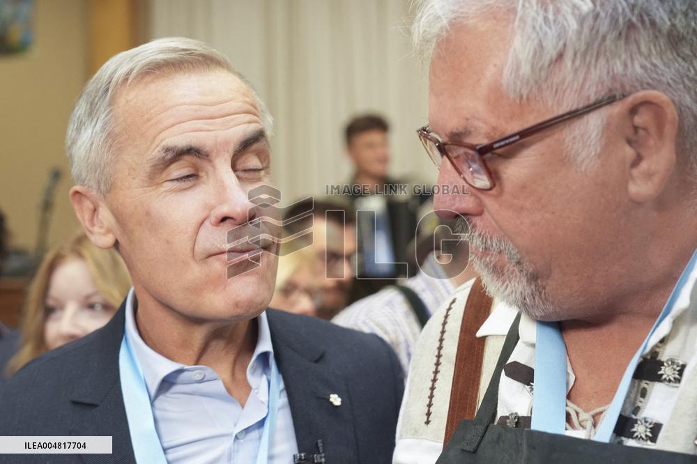 Prime Minister Taps Keg At Oktoberfest - Canada