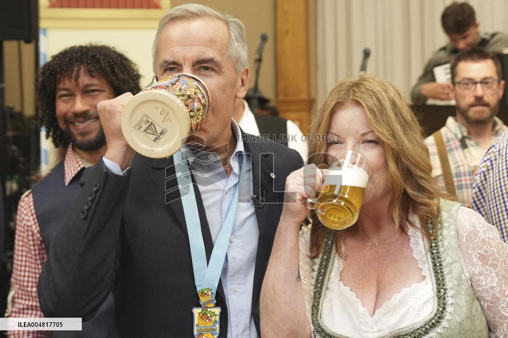 Prime Minister Taps Keg At Oktoberfest - Canada