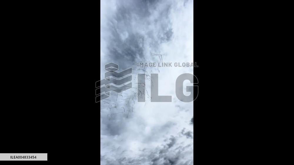 China: Flock of Migratory Geese Flies in Formation Over Jinchang, Gansu