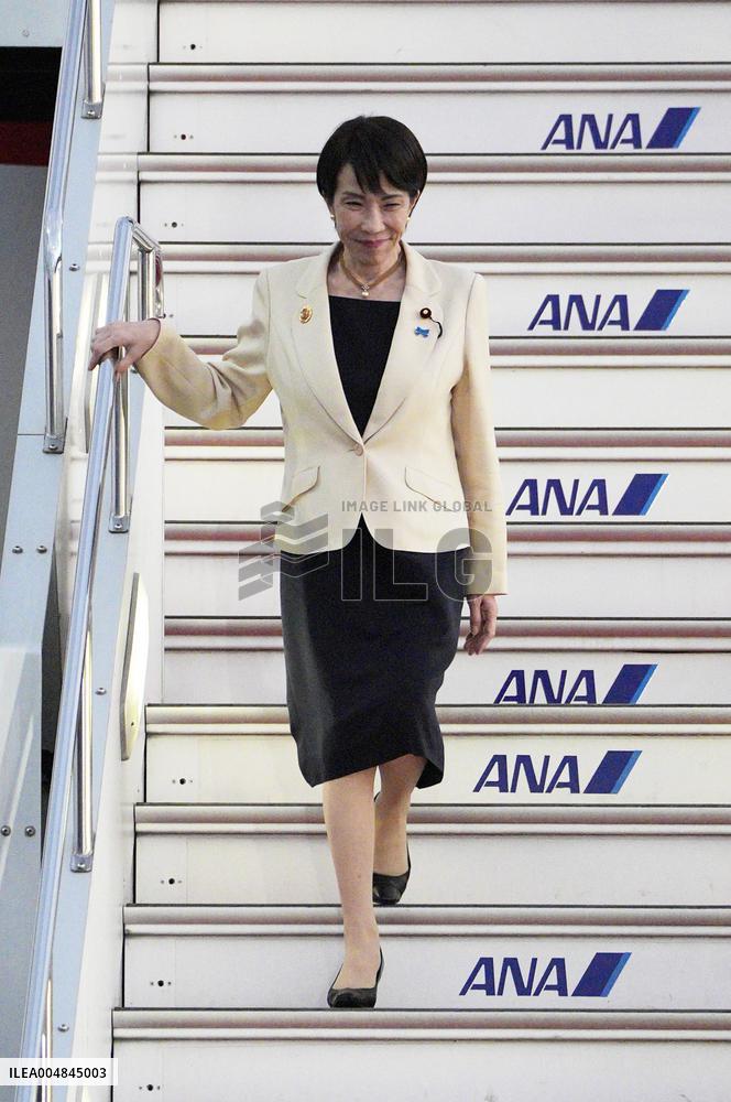 Japan PM Takaichi returns home