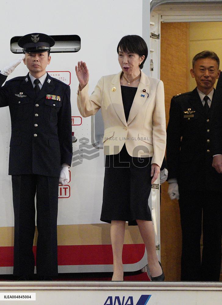 Japan PM Takaichi returns home