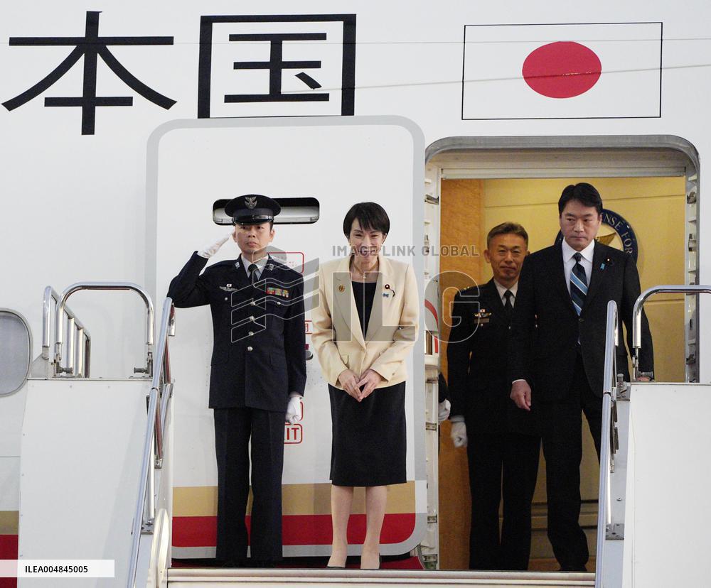 Japan PM Takaichi returns home