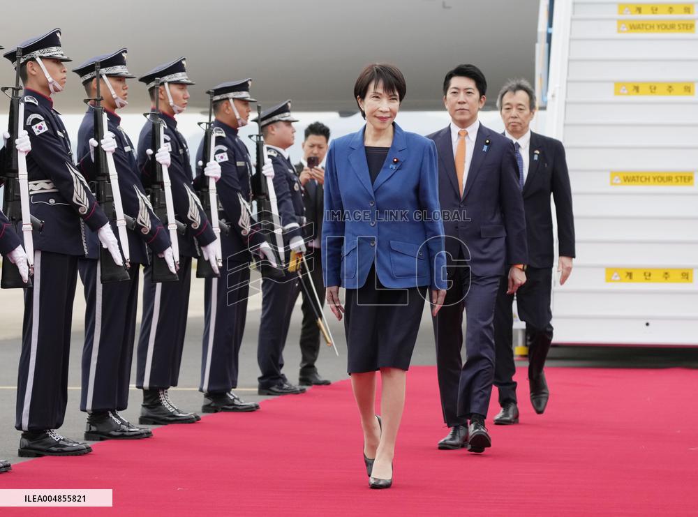 Japan PM Takaichi arrives in Busan