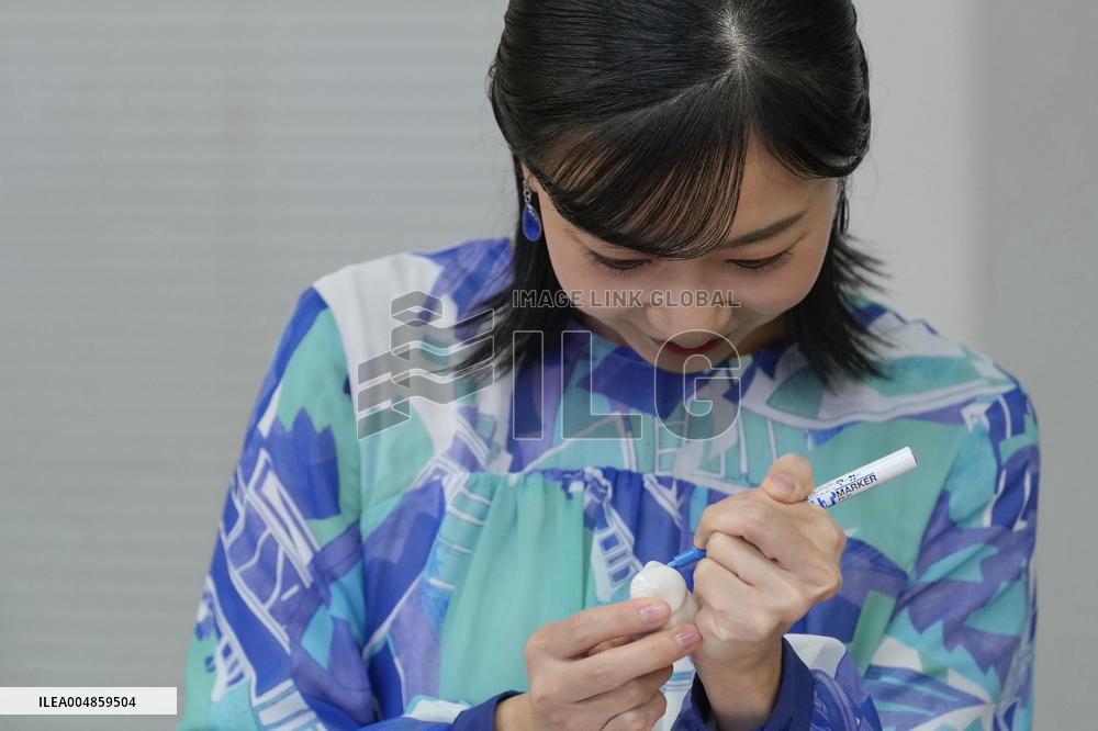 Princess Kako paints pottery