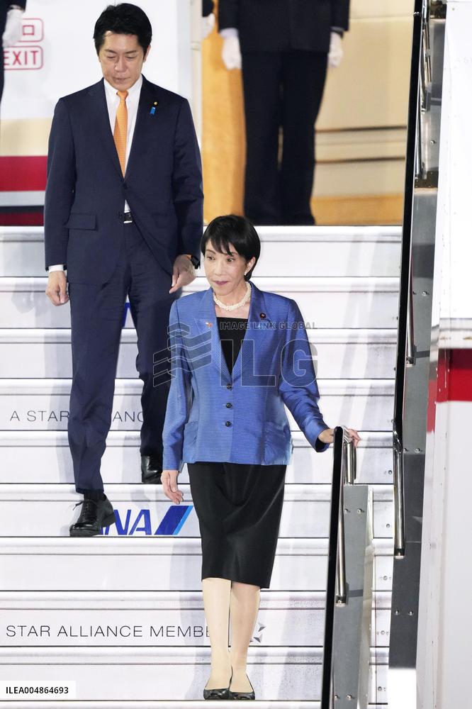 Japan PM Takaichi returns home