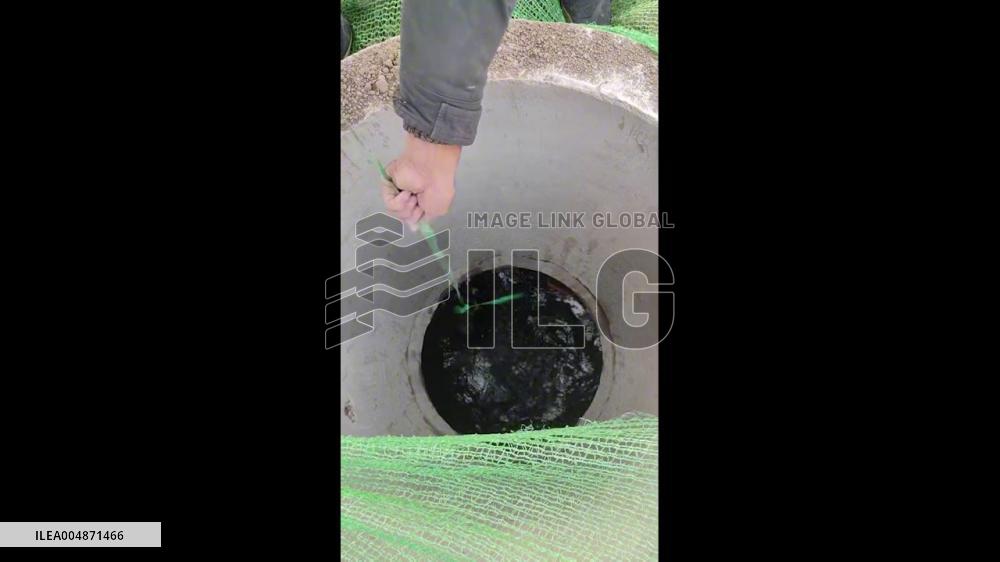 China: Workers Rescue Dog From Deep Water Well After Fall