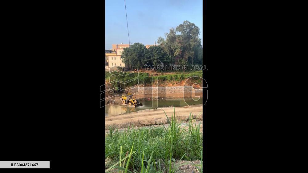 China: Excavator Scoops Water From Pond to Contain Loader Fire