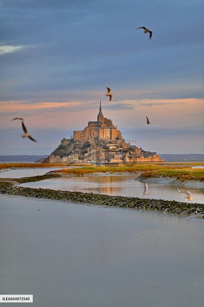 Mont-Saint-Michel and its bay in northwestern France. FC