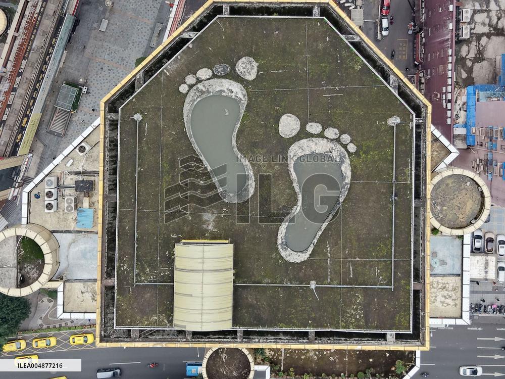 Giant Footprints on Building Rooftop in Chongqing