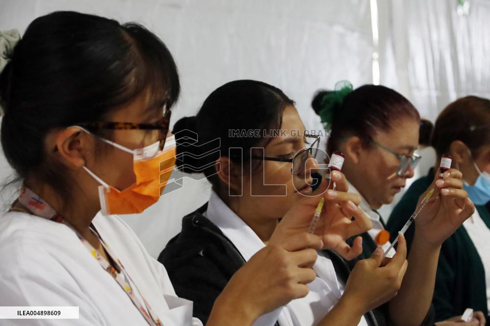 Vaccination Program Against Covid-19 and Influenza - Mexico City
