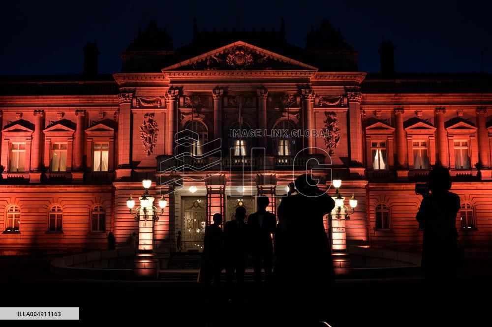 State Guest House lit in orange