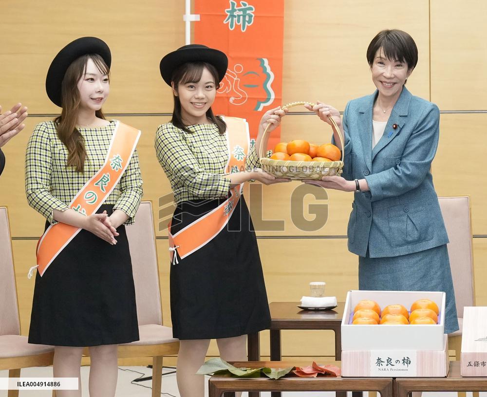Japan PM Takaichi receives persimmons