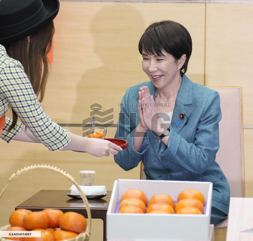 Japan PM Takaichi receives persimmons