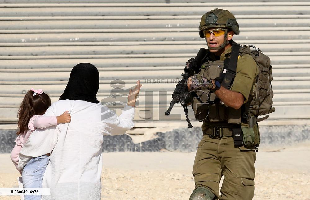 An Israeli Soldier Prevents Palestinians from Returning to Their Homes - Tulkarm