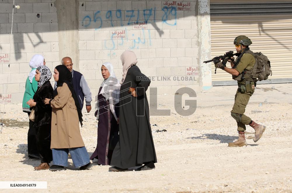 An Israeli Soldier Prevents Palestinians from Returning to Their Homes - Tulkarm