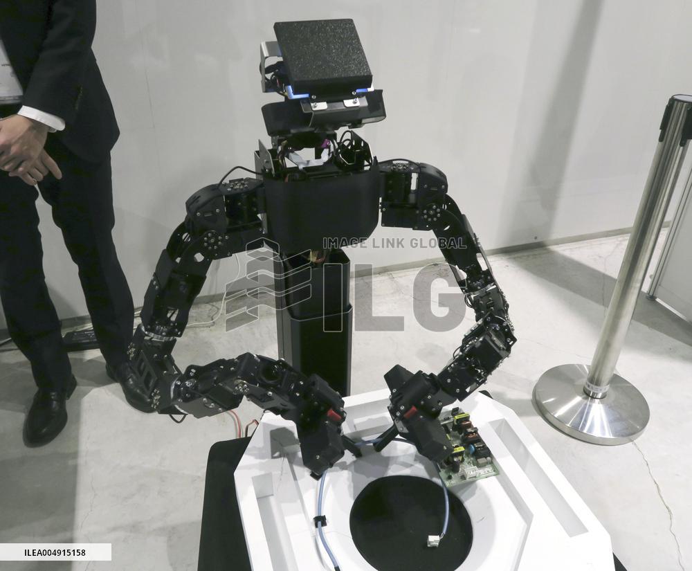 Hitachi robot engages in wiring work