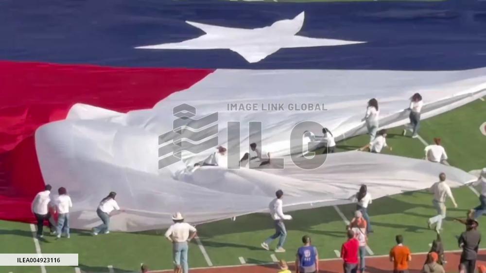 US: Flag Runner Carried on Giant Flag at College Football Game in Austin