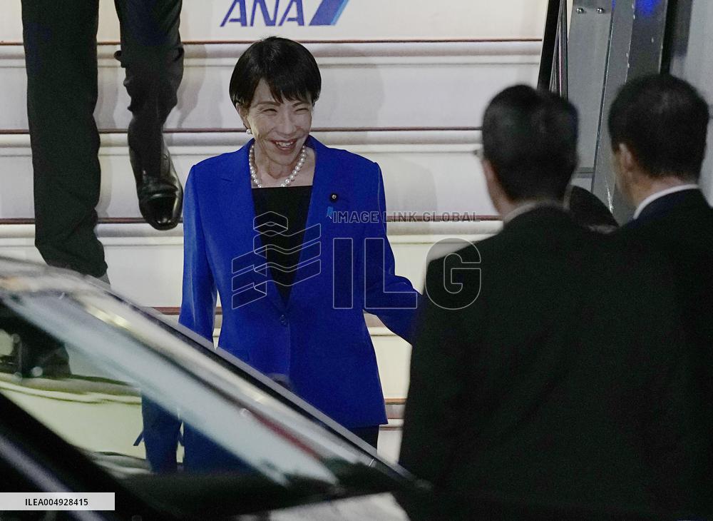 Japan PM Takaichi returns home