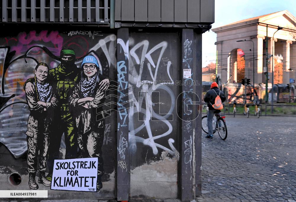 Provocative Wall Art Depicting Thunberg and Albanese with a Hamas Militant - Milan