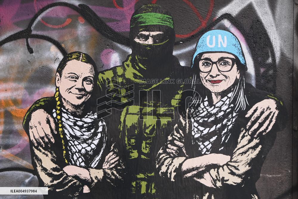 Provocative Wall Art Depicting Thunberg and Albanese with a Hamas Militant - Milan