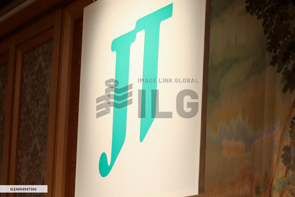 JT (Japan Tobacco Industries) signboard and logo