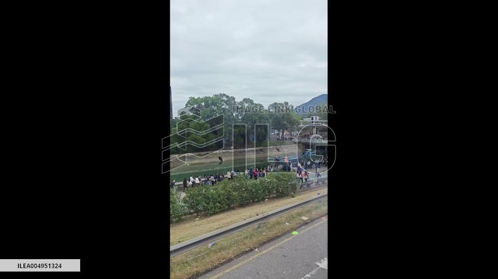Hong Kong: Long Lines of Mourners at Tai Po High-Rise Fire Site