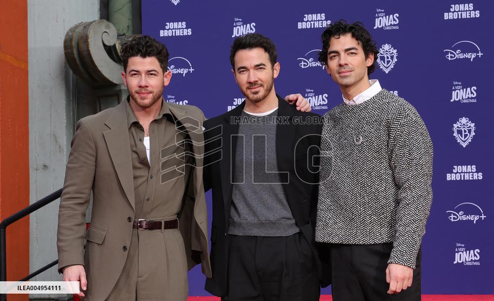 Jonas Brothers Hand And Footprint In Cement Ceremony - LA
