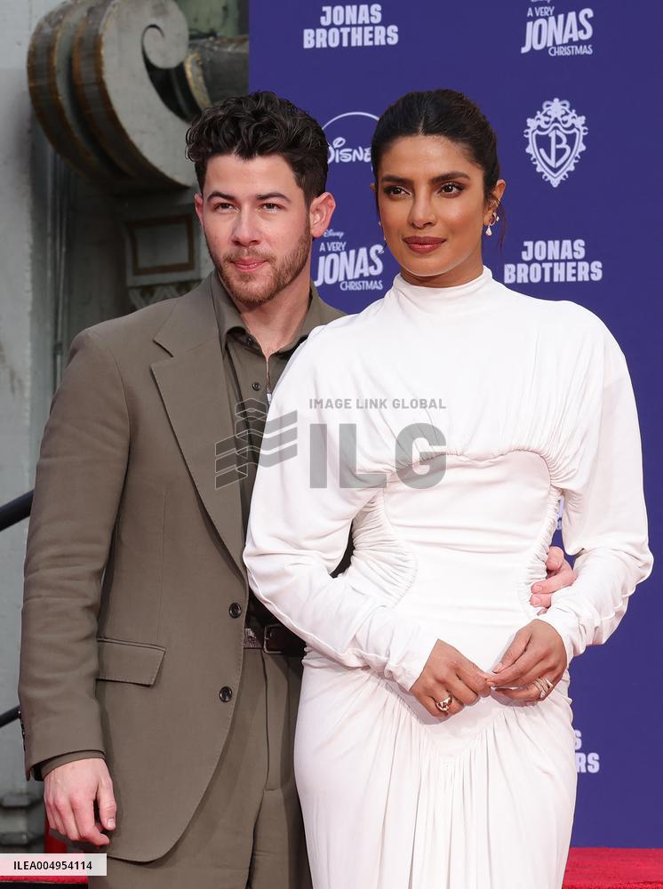 Jonas Brothers Hand And Footprint In Cement Ceremony - LA