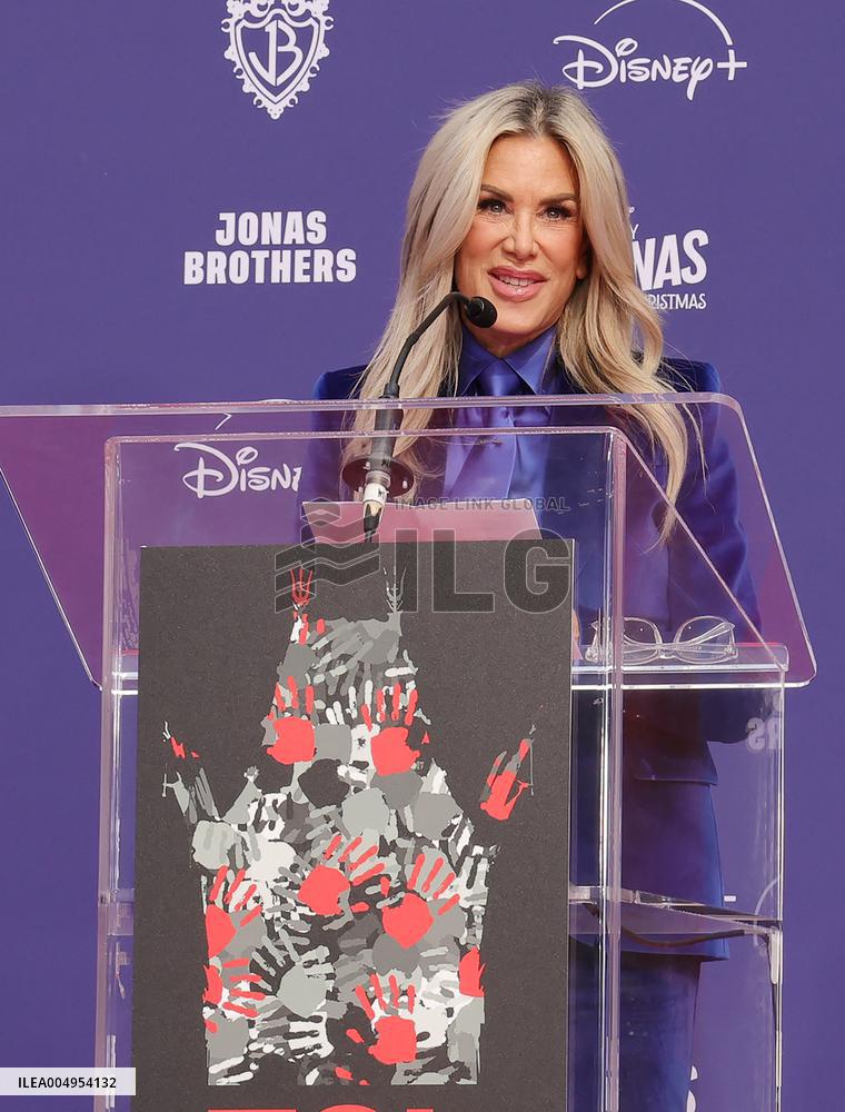 Jonas Brothers Hand And Footprint In Cement Ceremony - LA