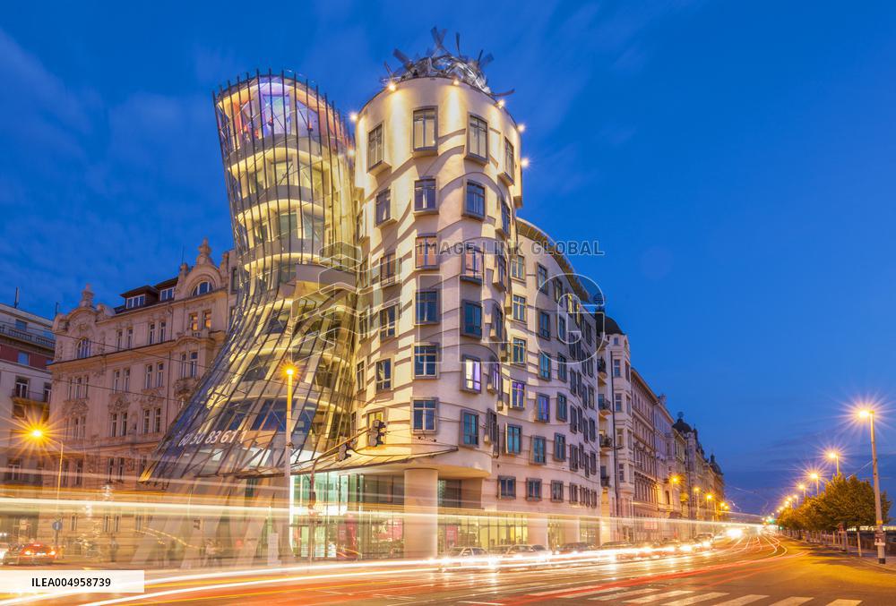 Dancing House or Ginger and Fred at night by Frank Gehry, busy traffic light trails, Prague, Bohemia, Czech Republic, EU, Europe