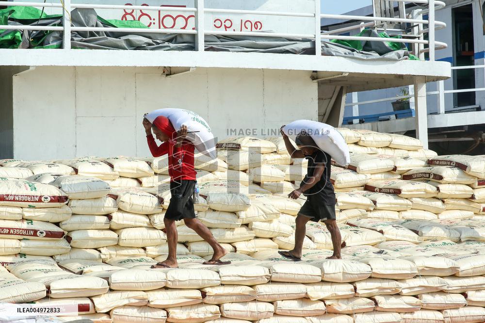 Workers Carry Bags of Rice - Myanmar