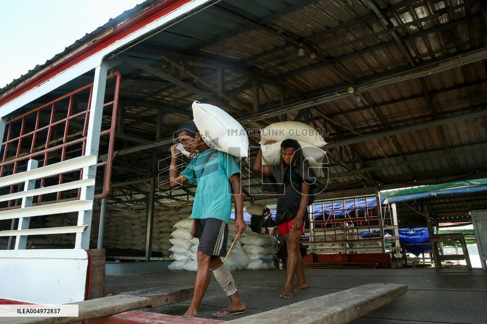 Workers Carry Bags of Rice - Myanmar