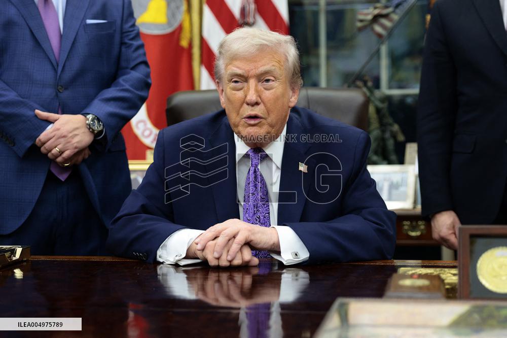 US President Donald J. Trump delivers remarks during a signing ceremony in the Oval Office