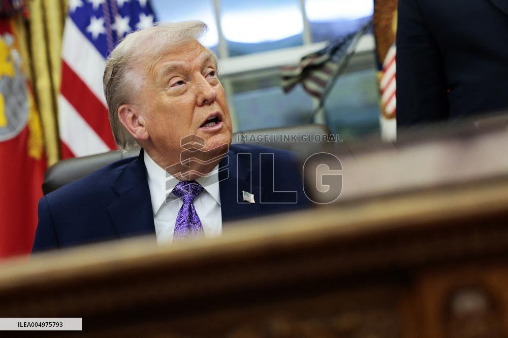 US President Donald J. Trump delivers remarks during a signing ceremony in the Oval Office