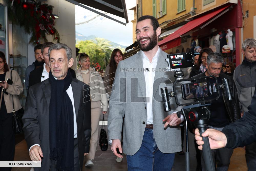 Nicolas Sarkozy And Son Leave Restaurant To Attend Book Signing - France