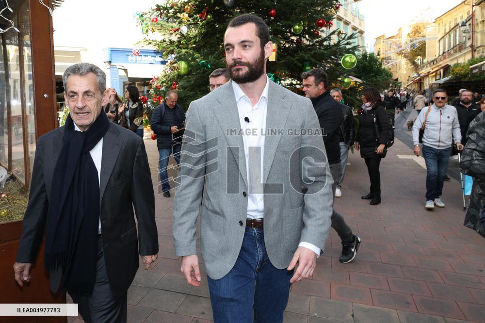 Nicolas Sarkozy And Son Leave Restaurant To Attend Book Signing - France