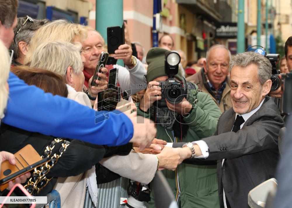 Nicolas Sarkozy And Son Leave Restaurant To Attend Book Signing - France