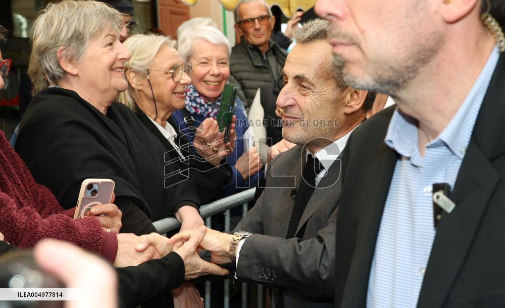 Nicolas Sarkozy And Son Leave Restaurant To Attend Book Signing - France