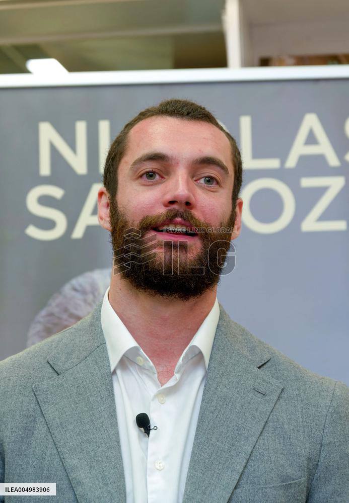 Nicolas and Louis Sarkozy At Public Book Signing - France