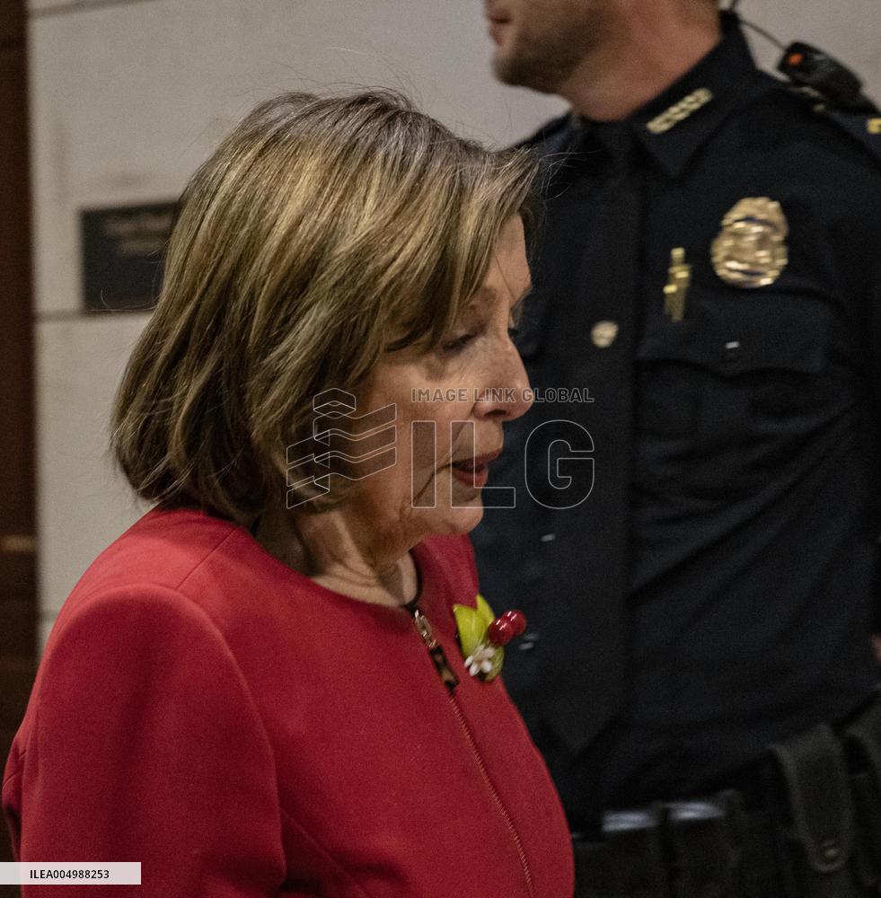 Former House Speaker Nancy Pelosi walks out  after  the  classified briefing